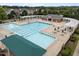 An elevated view of a community pool with lap lanes, lounge chairs, and a snack bar area at 1400 Gathering Park Cir # 204, Cary, NC 27519