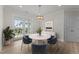 Bright dining area boasts a round table, and sliding doors to the balcony at 1400 Gathering Park Cir # 204, Cary, NC 27519