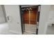 Modern residential elevator with wooden paneling at 1400 Gathering Park Cir # 204, Cary, NC 27519