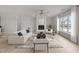 Bright living room featuring a fireplace, plush sofa, and large window views at 1400 Gathering Park Cir # 204, Cary, NC 27519