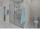 Elegant bathroom boasts a frameless glass shower, a rain shower head, and a stylishly tiled floor at 1400 Gathering Park Cir # 204, Cary, NC 27519