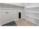Bright laundry area with built-in shelves, storage, and neutral flooring at 1400 Gathering Park Cir # 204, Cary, NC 27519