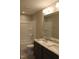 Bathroom featuring granite double vanity, tiled floors, shower and bath combo at 1415 Reading Ct # 77Kl, Burlington, NC 27217