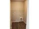 Functional laundry room with sleek cabinets and open shelving with a wood-look floor at 1415 Reading Ct # 77Kl, Burlington, NC 27217