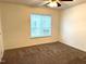 Cozy bedroom with plush carpeting and a bright, windowed view at 1430 Collegiate Cir # 102, Raleigh, NC 27606