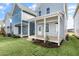 View of the backyard of the home showcasing a wooden porch and new grass at 1662 Piney Fls Dr, Wendell, NC 27591
