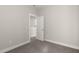 A bedroom with neutral walls and carpet, showcasing a white door and trim at 1662 Piney Fls Dr, Wendell, NC 27591