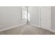 Empty carpeted bedroom with a window and natural light at 1662 Piney Fls Dr, Wendell, NC 27591