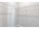 A walk-in closet with white walls and shelving at 1662 Piney Fls Dr, Wendell, NC 27591