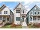 Inviting two-story home with light-blue siding and white trim, nestled between similar residences at 1662 Piney Fls Dr, Wendell, NC 27591