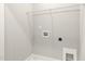 Unfinished laundry room featuring connections and shelf at 1662 Piney Fls Dr, Wendell, NC 27591