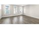 Bright living room featuring modern vinyl floors, white trim, and neutral paint at 1662 Piney Fls Dr, Wendell, NC 27591
