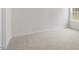 Bedroom featuring neutral carpeting and a large window at 1705 Post Oak Dr, Haw River, NC 27258