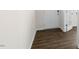 View of entryway featuring luxury vinyl flooring, neutral walls and white trim at 1705 Post Oak Dr, Haw River, NC 27258