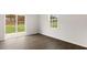Bright living room with hardwood flooring, window and access to the outdoors at 1705 Post Oak Dr, Haw River, NC 27258