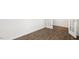 View of a room featuring luxury vinyl flooring, neutral walls and white trim at 1705 Post Oak Dr, Haw River, NC 27258