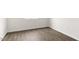 Neutral room with hardwood floors and white trim at 1705 Post Oak Dr, Haw River, NC 27258