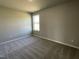 Neutral bedroom with a window and soft carpet flooring, ready for personalization at 181 Pate Landing Dr, Selma, NC 27576
