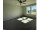 Inviting bedroom with plush carpeting, a ceiling fan, and natural light from a large window at 181 Pate Landing Dr, Selma, NC 27576