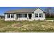 Charming single-story home with gray siding, a well-manicured lawn, and professionally landscaped front yard at 181 Pate Landing Dr, Selma, NC 27576