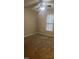 Carpeted bedroom featuring a ceiling fan, window, and neutral decor at 1828 Parkside Village Dr, Clayton, NC 27520