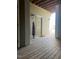 Entrance to the home featuring a covered porch, potted plant, and wooden decking at 1828 Parkside Village Dr, Clayton, NC 27520