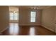 Bright, open living area with windows and hardwood floors at 1828 Parkside Village Dr, Clayton, NC 27520