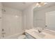 Well-lit bathroom featuring a shower-tub combo and a vanity with a white countertop at 197 S Finley Landing Parkway # 85, Smithfield, NC 27577