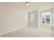Bright bedroom showcasing neutral walls and carpet, complemented by natural light from two windows at 197 S Finley Landing Parkway # 85, Smithfield, NC 27577