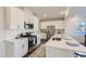 Modern kitchen with white cabinets, stainless steel appliances, and a center island at 197 S Finley Landing Parkway # 85, Smithfield, NC 27577