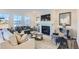 Inviting living room with a fireplace, stylish furniture, and scenic views through expansive windows at 197 S Finley Landing Parkway # 85, Smithfield, NC 27577