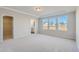 Spacious main bedroom with ample natural light, a tray ceiling, and a walk-in closet at 197 S Finley Landing Parkway # 85, Smithfield, NC 27577
