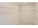 Spacious walk-in closet features white wire shelving for optimal organization and storage at 197 S Finley Landing Parkway # 85, Smithfield, NC 27577