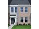 Charming two-story home with a combination of brick and siding, plus manicured landscaping at 207 Frosted Iris Lane St # 180, Garner, NC 27529