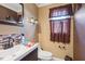 Neat half bathroom with updated fixtures and a large mirror at 209 James St, Apex, NC 27502
