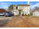 Charming two-story home with a well-manicured lawn and driveway at 209 James St, Apex, NC 27502