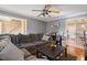 Spacious living room featuring a comfortable sofa and hardwood floors at 209 James St, Apex, NC 27502