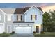 Charming two-story home features a white garage door and a gray and white color scheme at 3402 Pelican Ln, Durham, NC 27703