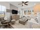 Sun-filled living room with modern furnishings and large windows, open and inviting at 3402 Pelican Ln, Durham, NC 27703