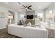 Bright and airy living room with modern furniture, fan, and large windows at 3402 Pelican Ln, Durham, NC 27703