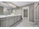 Spacious bathroom with double vanity, modern fixtures, and separate tiled shower at 3406 Pelican Ln, Durham, NC 27703