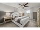 Cozy bedroom with ceiling fan, decorative wall, carpet, and bedside tables at 3406 Pelican Ln, Durham, NC 27703