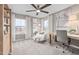 Bright bedroom with neutral tones, carpet, desk, and three large windows overlooking the neighborhood at 3406 Pelican Ln, Durham, NC 27703