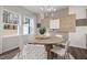 Bright dining area featuring modern decor, neutral tones, and large windows at 3406 Pelican Ln, Durham, NC 27703