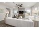 Bright living room with comfortable seating, a ceiling fan, and ample natural light at 3406 Pelican Ln, Durham, NC 27703