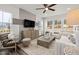 Well-lit living room featuring modern decor, neutral tones, and a cozy seating arrangement at 3406 Pelican Ln, Durham, NC 27703