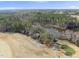 Aerial view of a home situated by a pond and a golf course at 4041 Wendy Ln, Zebulon, NC 27597