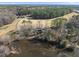 Aerial view of a house by a pond and a golf course at 4041 Wendy Ln, Zebulon, NC 27597