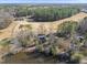 Aerial view of a home adjacent to a scenic pond and golf course at 4041 Wendy Ln, Zebulon, NC 27597