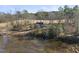 Scenic view of a home surrounded by water, trees, and golf course at 4041 Wendy Ln, Zebulon, NC 27597